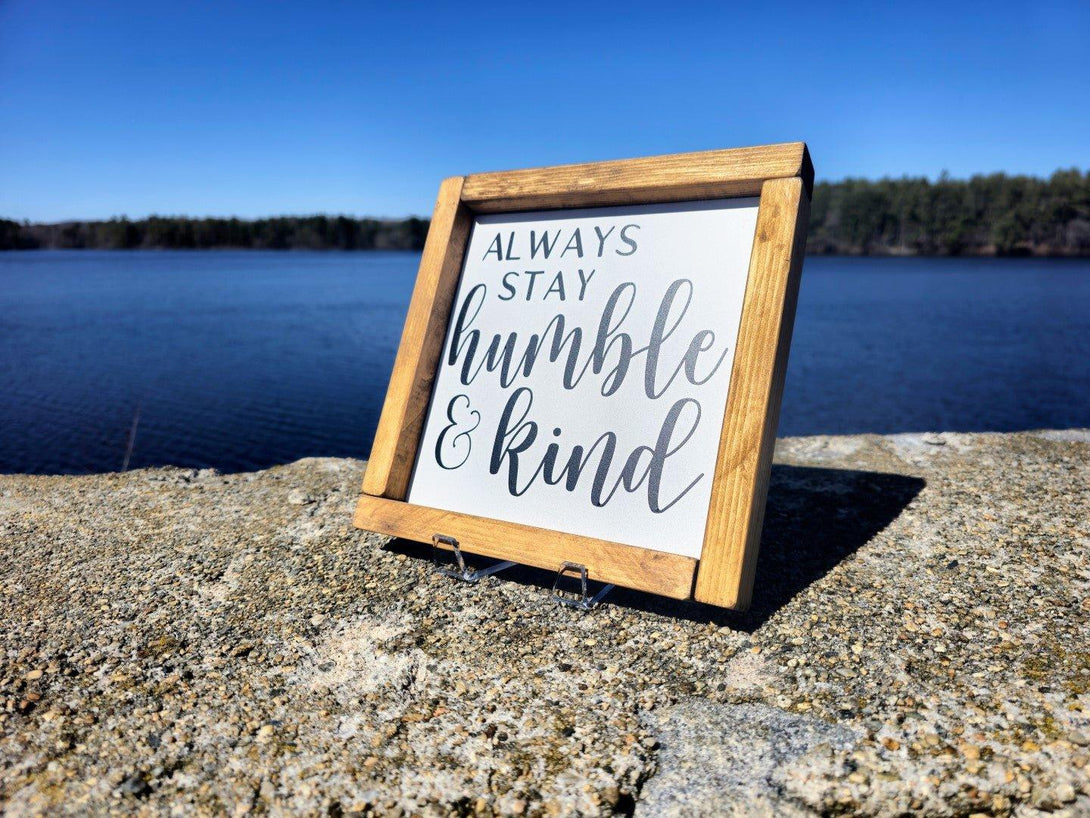 Always Stay Humble And Kind Framed Home Decor Sign with water in the background